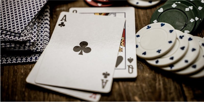Baccarat playing cards and casino chips; JackpotCity Casino Blog