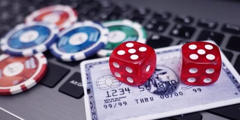 Casino chips and dice on card