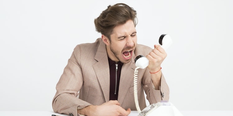 Grumpy Man shouting in telephone