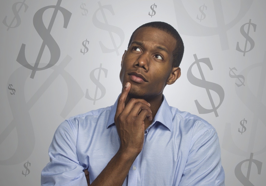 A man thinking about money; JackpotCity Casino Blog