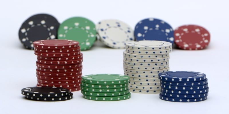 Stacks of casino chips against a white background; JackpotCity Casino Blog