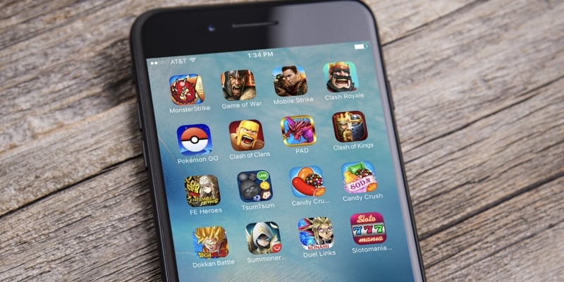 iPhone with game icons; Spin Casino Blog