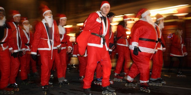 Several men roll by in Santa suits while on roller skates as they skate to mass in Caracas; Spin Palace Blog