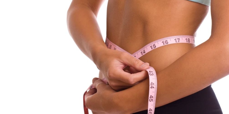 Women measuring waist; Spin Palace Blog