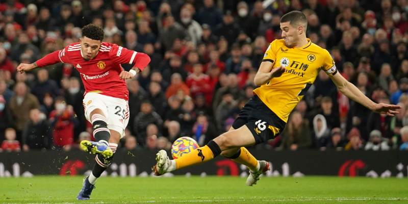 Manchester United's Jadon Sancho has a shot blocked by Conor Coady during the defeat to Wolves