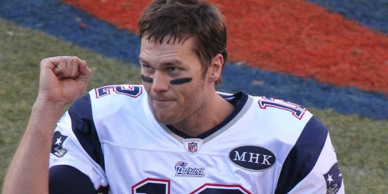Brady with black greasepaint under his eyes, wearing his iconic number 12 Patriots jersey. Image by 