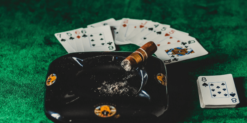casino cards and a cigar