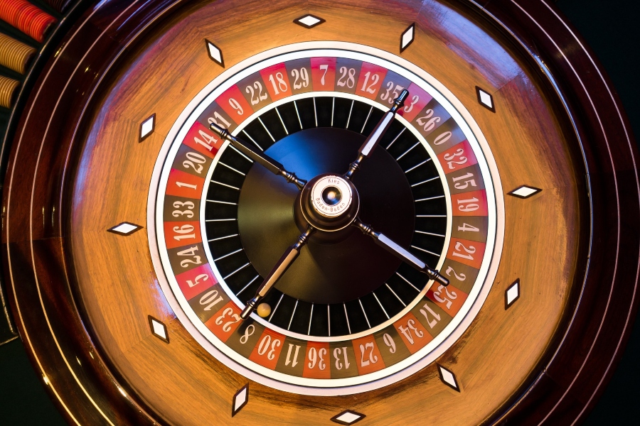 A top-down shot of a French Roulette wheel.