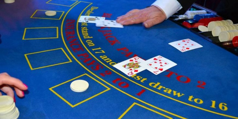 blackjack table dealer chips cards