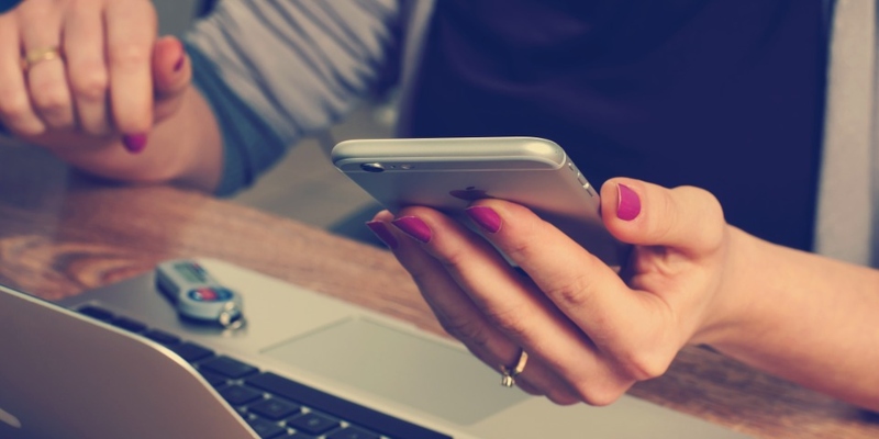 woman's hand holding a mobile phone