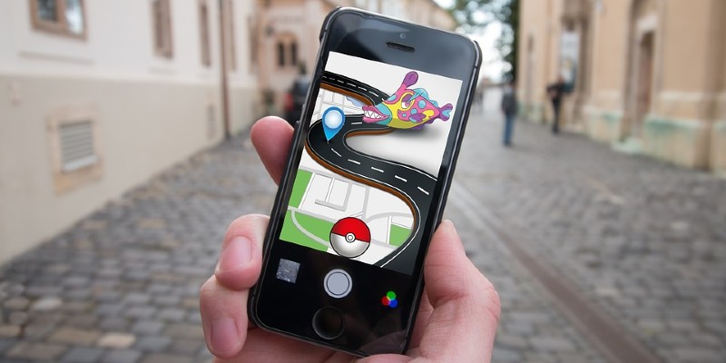 Pokemon Go on a smartphone screen in the street