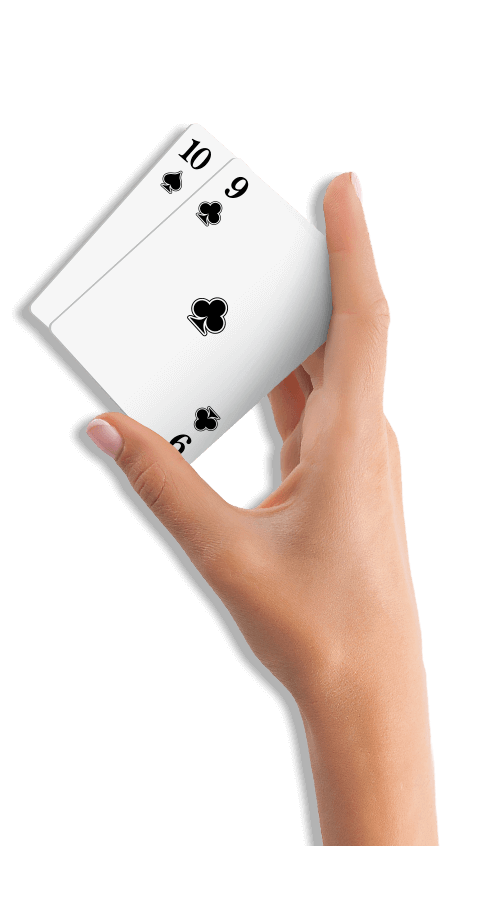 White female hand holding two casino cards