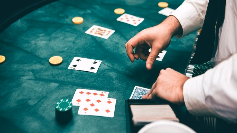 image of a blackjack dealer at a blackjack table